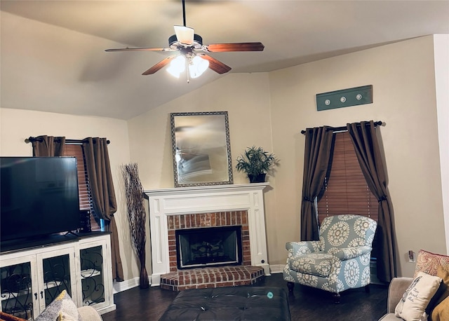 10159 English Oaks Dr, Keithville, LA 71047 - living area featuring lofted ceiling, ceiling fan, a brick fireplace, wood finished floors, and baseboards