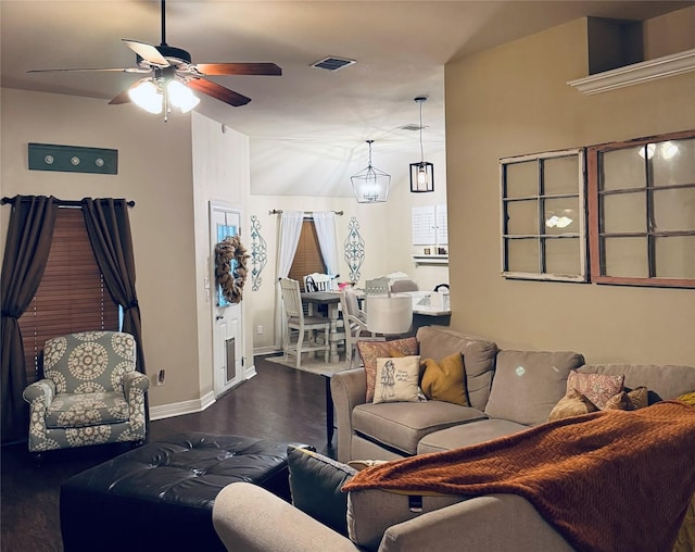 10159 English Oaks Dr, Keithville, LA 71047 - living room featuring a ceiling fan, wood finished floors, baseboards, and vaulted ceiling