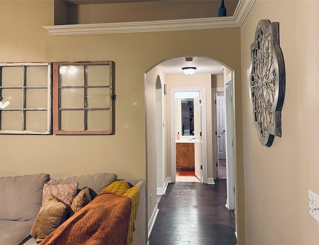 10159 English Oaks Dr, Keithville, LA 71047 - hall featuring arched walkways, dark wood finished floors, crown molding, and baseboards