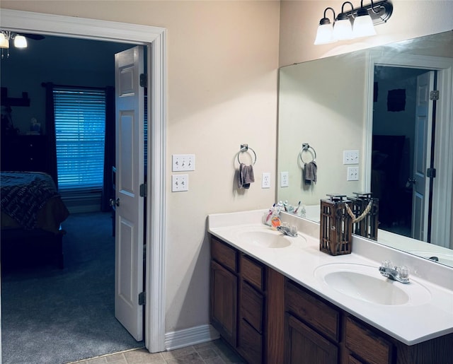 10159 English Oaks Dr, Keithville, LA 71047 - bathroom featuring ensuite bathroom, double vanity, and baseboards