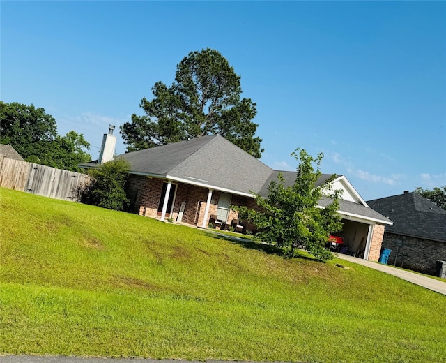 10159 English Oaks Dr, Keithville, LA 71047 - ranch-style home featuring a chimney, driveway, an attached garage, and brick siding