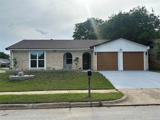 7501 Echo Hill Dr, Watauga, TX 76148 - ranch-style house featuring an attached garage, concrete driveway, a front lawn, brick siding, and a shingled roof