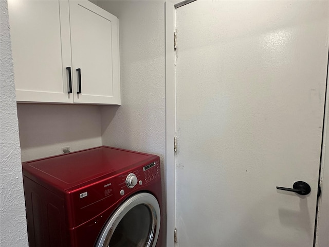 7501 Echo Hill Dr, Watauga, TX 76148 - washroom with washer / dryer and cabinet space