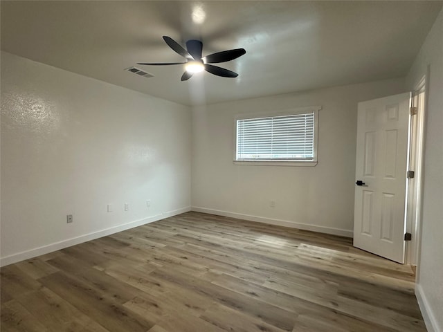 7501 Echo Hill Dr, Watauga, TX 76148 - unfurnished bedroom featuring wood finished floors, baseboards, and a ceiling fan