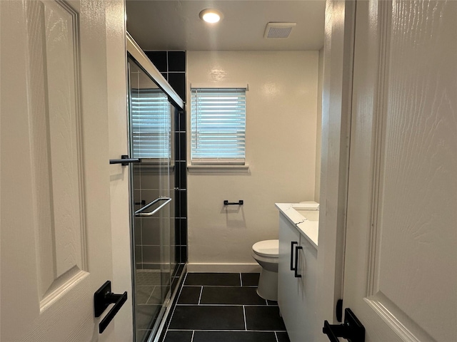 7501 Echo Hill Dr, Watauga, TX 76148 - bathroom with tile patterned flooring, vanity, a stall shower, toilet, and baseboards