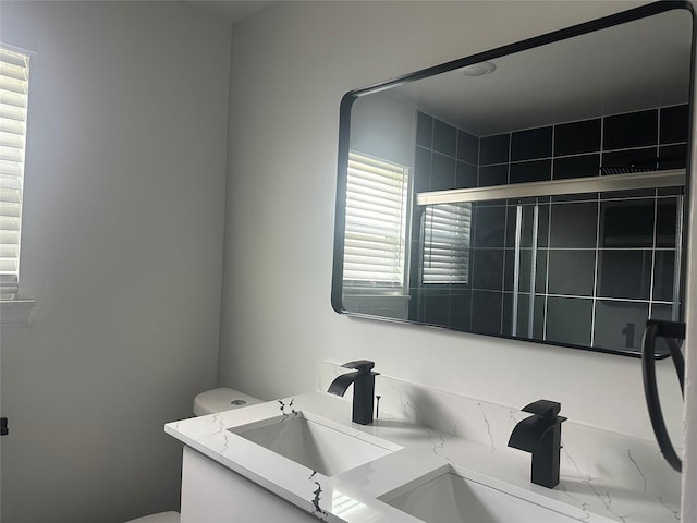 7501 Echo Hill Dr, Watauga, TX 76148 - full bathroom with double vanity and toilet