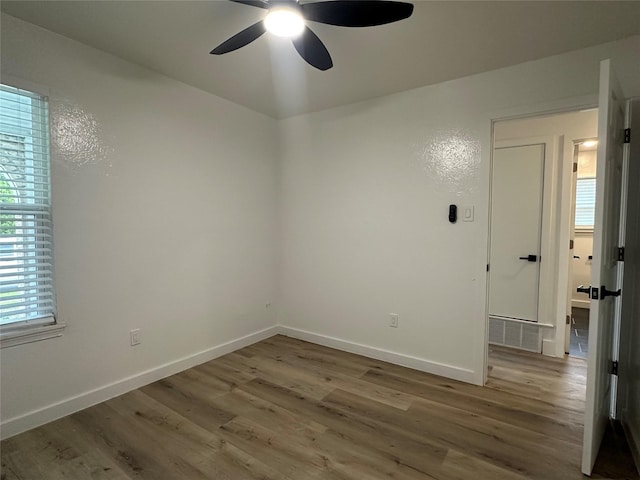 7501 Echo Hill Dr, Watauga, TX 76148 - empty room featuring wood finished floors, ceiling fan, and baseboards