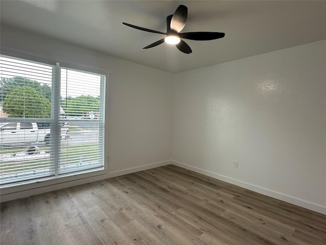 7501 Echo Hill Dr, Watauga, TX 76148 - unfurnished room with a ceiling fan, wood finished floors, and baseboards