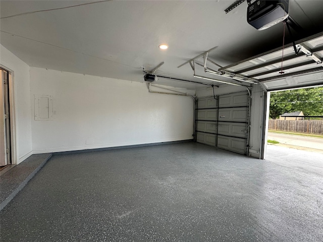 7501 Echo Hill Dr, Watauga, TX 76148 - garage with a garage door opener and baseboards