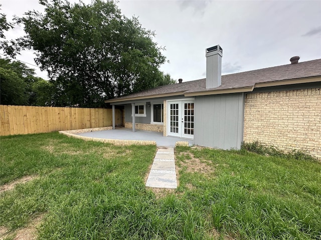 7501 Echo Hill Dr, Watauga, TX 76148 - rear view of property featuring french doors, a patio, and a chimney