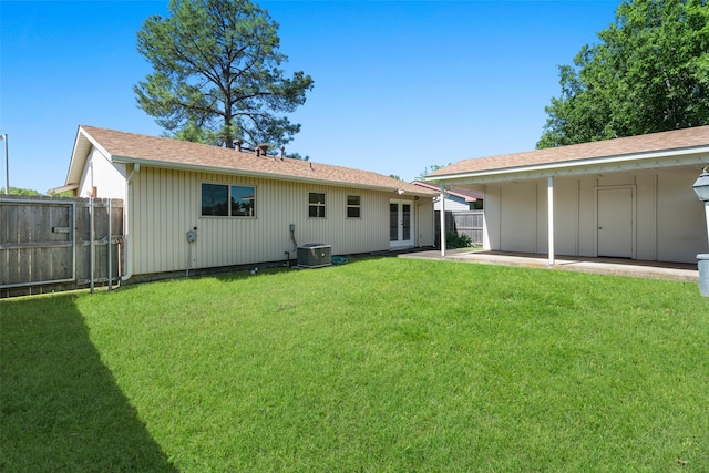 921 Meadow Mead Dr, Allen, TX 75002 - back of property featuring french doors, a patio, central air condition unit, and board and batten siding