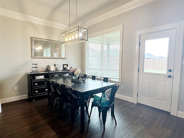 7415 Morning Glory Rd, Abilene, TX 79602 - dining space featuring crown molding, baseboards, dark wood-type flooring, and a chandelier