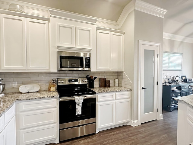 7415 Morning Glory Rd, Abilene, TX 79602 - kitchen with appliances with stainless steel finishes, crown molding, white cabinetry, tasteful backsplash, and dark wood-style floors