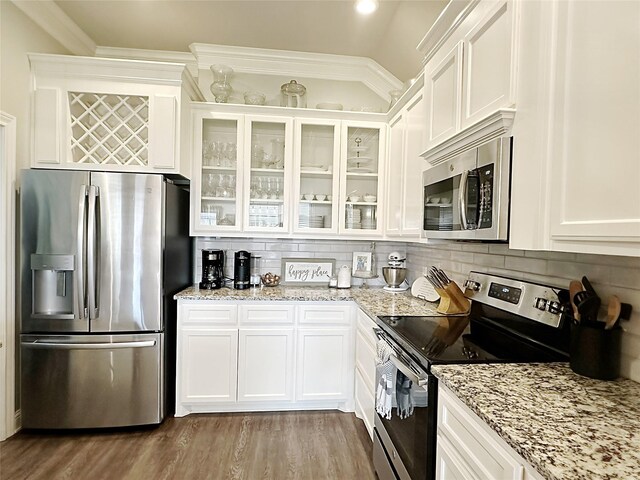 7415 Morning Glory Rd, Abilene, TX 79602 - kitchen featuring stainless steel appliances, white cabinetry, glass insert cabinets, and backsplash