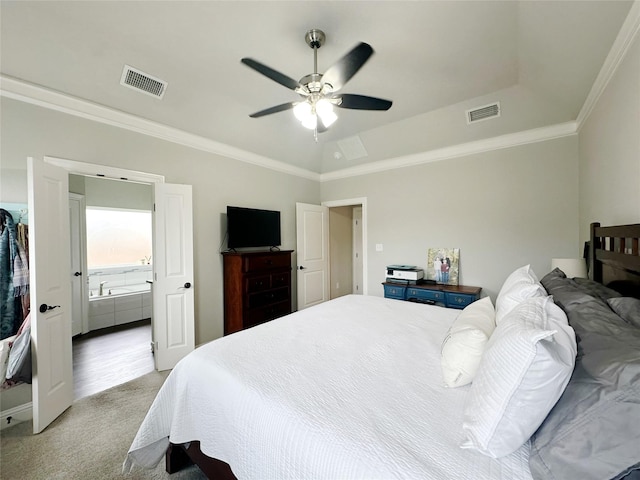 7415 Morning Glory Rd, Abilene, TX 79602 - bedroom featuring light colored carpet, crown molding, ensuite bath, a tray ceiling, and a ceiling fan