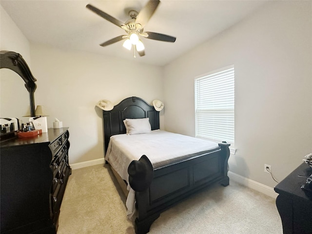 7415 Morning Glory Rd, Abilene, TX 79602 - bedroom with light carpet, baseboards, and ceiling fan