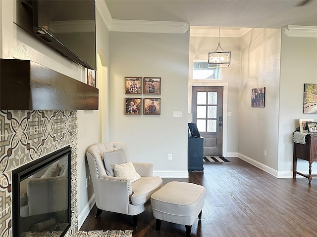 7415 Morning Glory Rd, Abilene, TX 79602 - entrance foyer with ornamental molding, dark wood-style flooring, baseboards, a chandelier, and a fireplace