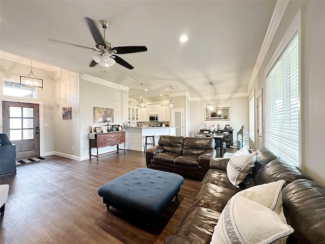 7415 Morning Glory Rd, Abilene, TX 79602 - living area with a chandelier, dark wood-type flooring, a ceiling fan, crown molding, and baseboards