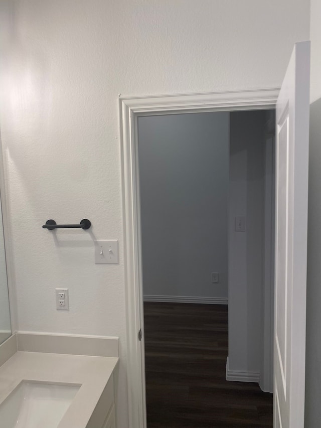 1613 Pine Valley Dr, Fort Worth, TX 76052 - bathroom with wood finished floors, vanity, and baseboards