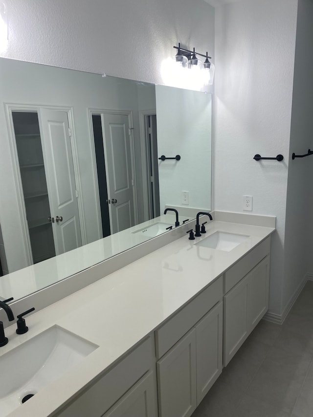 1613 Pine Valley Dr, Fort Worth, TX 76052 - full bath with tile patterned flooring, double vanity, and baseboards