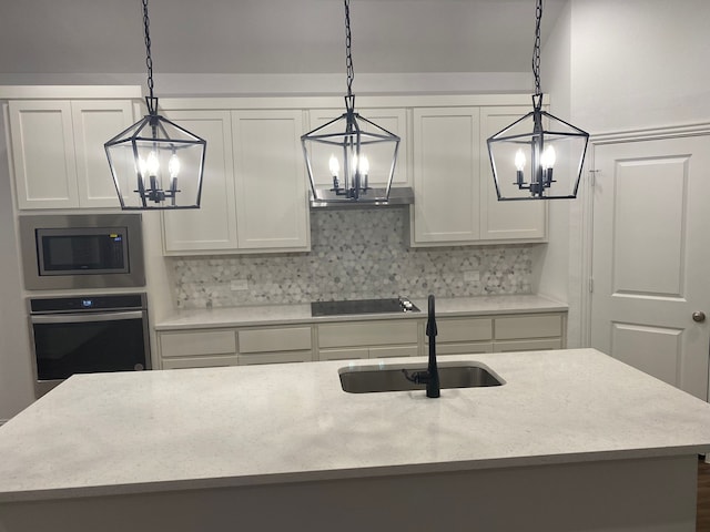 1613 Pine Valley Dr, Fort Worth, TX 76052 - kitchen featuring a chandelier, appliances with stainless steel finishes, a sink, and decorative backsplash