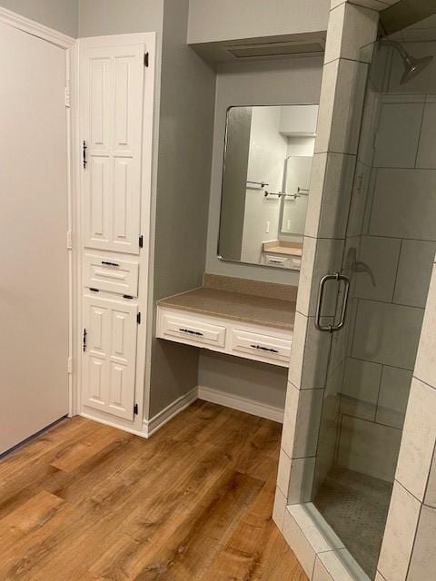 1942 S Lakeshore, Rockwall, TX 75087 - bathroom featuring a shower stall, wood finished floors, and vanity