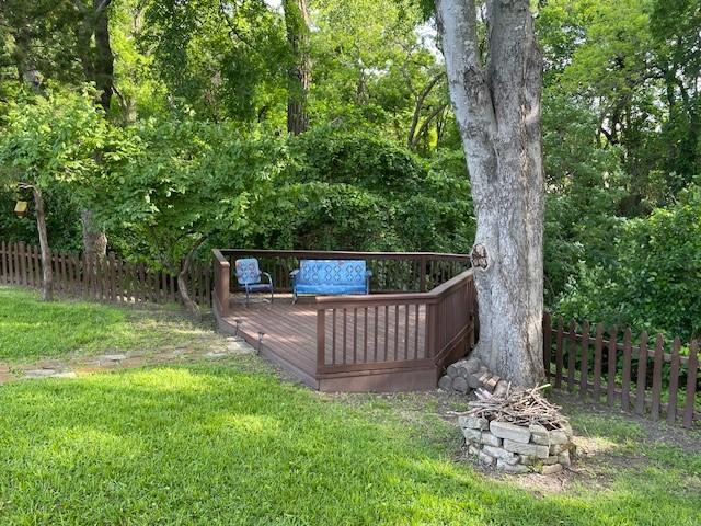 1942 S Lakeshore, Rockwall, TX 75087 - view of yard featuring a wooden deck and an outdoor fire pit