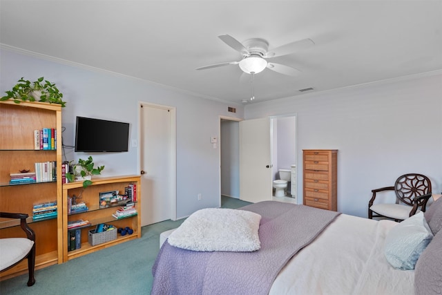 bedroom featuring crown molding, carpet flooring, and connected bathroom