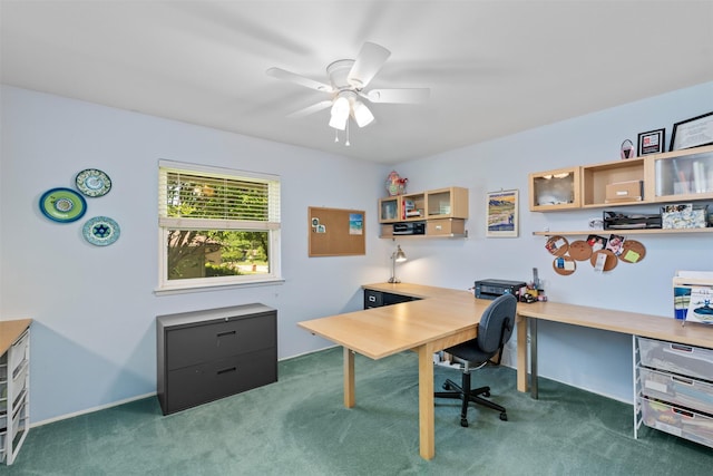 carpeted office featuring ceiling fan