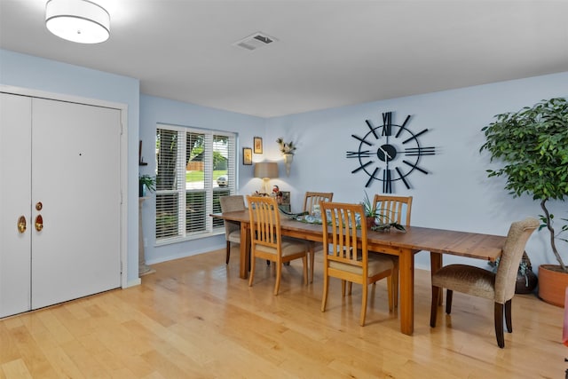 dining space featuring light wood-style floors
