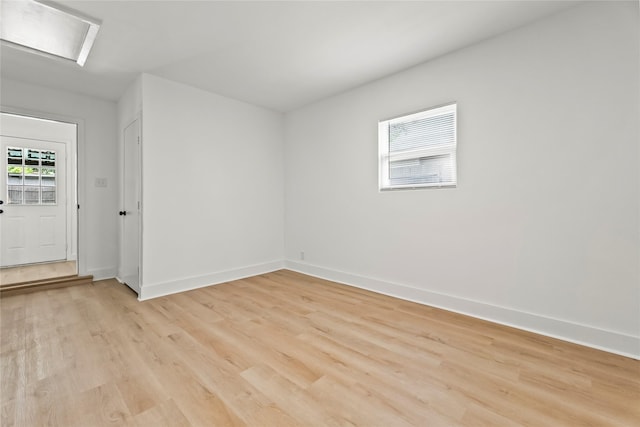 1303 Johns Dr, Euless, TX 76039 - spare room with light wood-style floors and baseboards