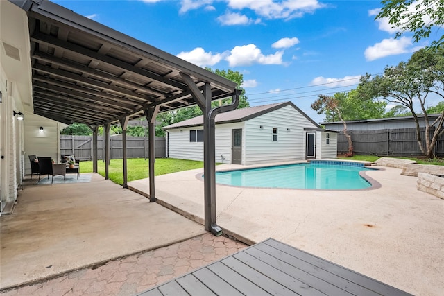 1303 Johns Dr, Euless, TX 76039 - view of pool with a patio area and an outdoor structure
