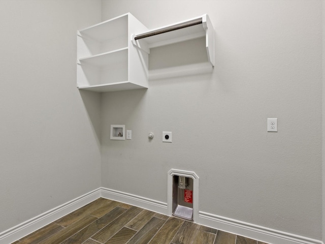 1423 Daisy Corner Dr, Celina, TX 75078 - laundry area with hookup for a gas dryer, electric dryer hookup, dark wood-style floors, washer hookup, and baseboards