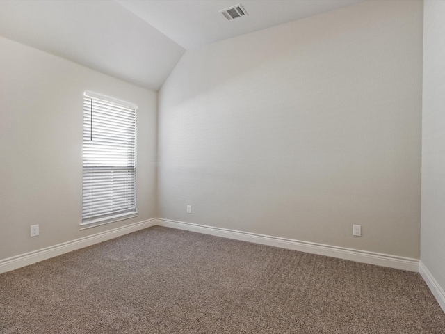 1423 Daisy Corner Dr, Celina, TX 75078 - spare room featuring carpet floors, lofted ceiling, and baseboards