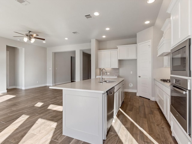 1423 Daisy Corner Dr, Celina, TX 75078 - kitchen featuring appliances with stainless steel finishes, a sink, light countertops, white cabinetry, and dark wood-style floors