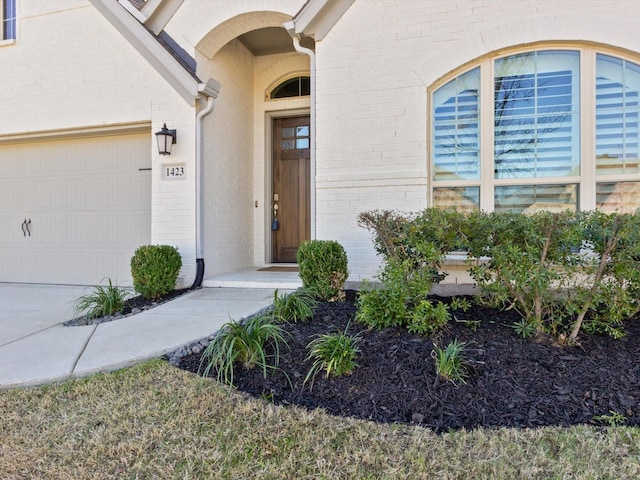 1423 Daisy Corner Dr, Celina, TX 75078 - property entrance featuring brick siding and a garage