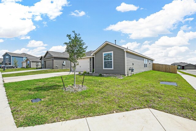 13713 Beaverhead St, Ponder, TX 76259 - view of front of house with a garage, concrete driveway, and a residential view