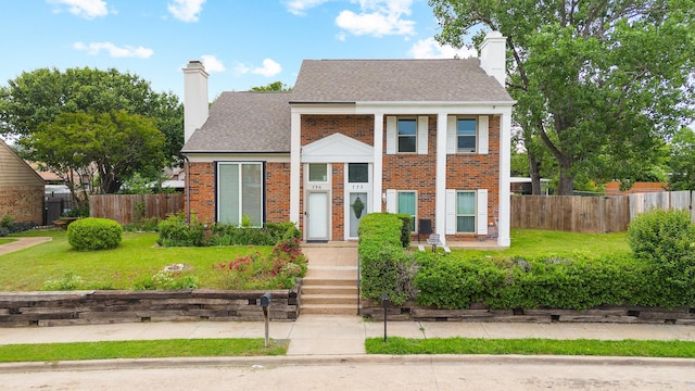 736 Lee St, Mesquite, TX 75149 - view of front of home featuring a chimney, brick siding, and a shingled roof