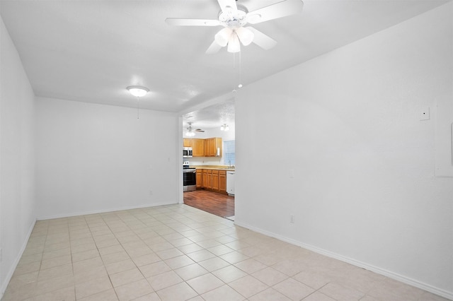 736 Lee St, Mesquite, TX 75149 - unfurnished living room featuring ceiling fan, baseboards, and light tile patterned floors