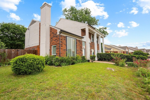736 Lee St, Mesquite, TX 75149 - view of property exterior featuring brick siding and a chimney