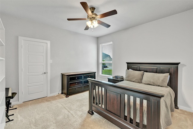 14521 Home Trl, Fort Worth, TX 76262 - bedroom with light colored carpet, baseboards, a ceiling fan, and a desk