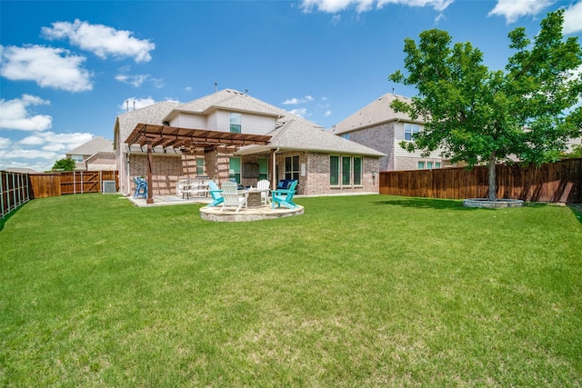 1417 Madrid Falls Dr, Mckinney, TX 75071 - back of property with a pergola, brick siding, a patio area, and central AC