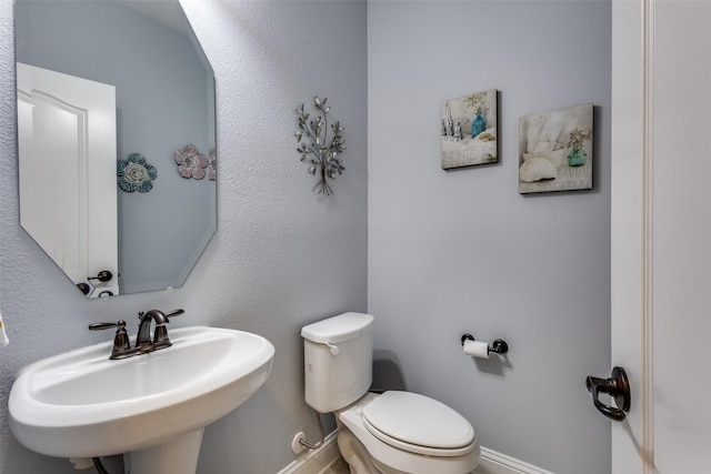 1417 Madrid Falls Dr, Mckinney, TX 75071 - bathroom with a sink, baseboards, and toilet