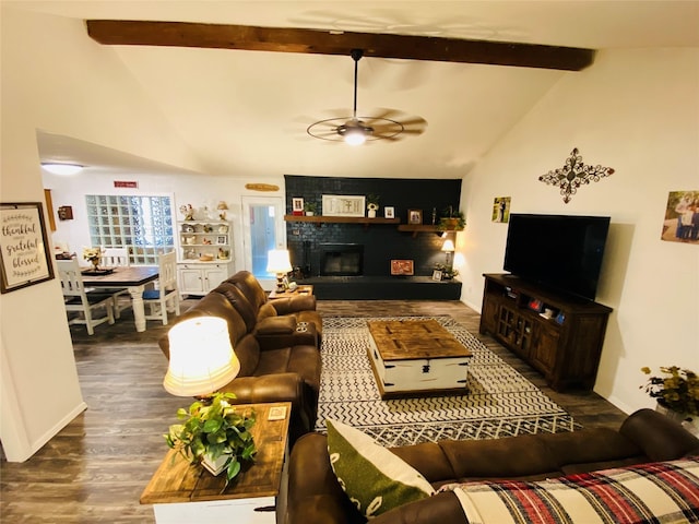 living room featuring a ceiling fan, wood finished floors, a fireplace, and baseboards