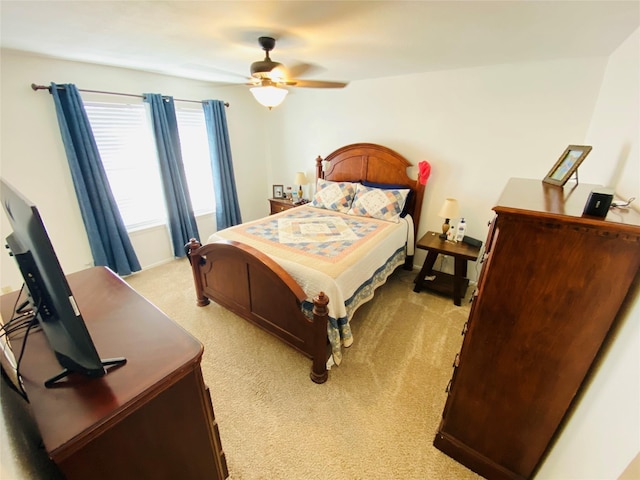 bedroom featuring light carpet and ceiling fan