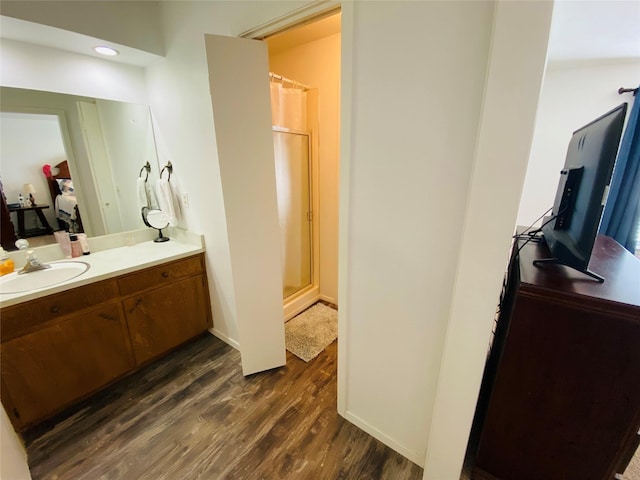 bathroom with wood finished floors, vanity, and a shower with shower curtain