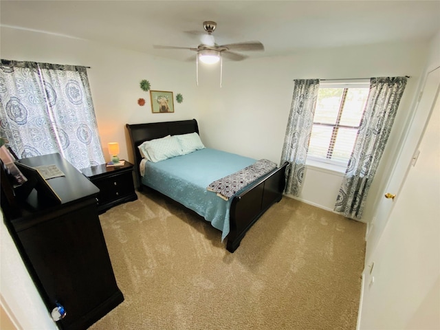 carpeted bedroom featuring a ceiling fan