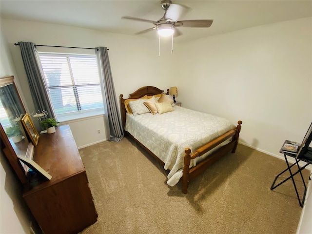 bedroom featuring carpet flooring, baseboards, and a ceiling fan