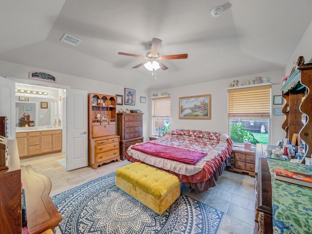 2400 Briarhurst Ct, Denton, TX 76207 - bedroom with lofted ceiling, light tile patterned floors, ensuite bathroom, and ceiling fan