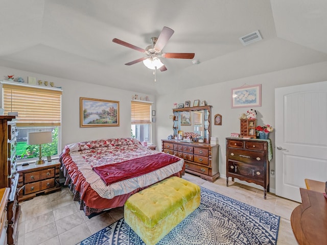 2400 Briarhurst Ct, Denton, TX 76207 - bedroom with multiple windows, light tile patterned floors, a ceiling fan, and vaulted ceiling